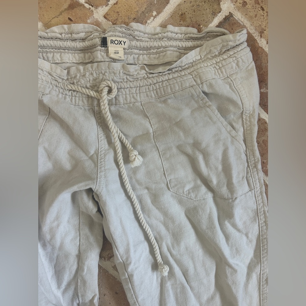 Roxy flared linen pants in natural color. Size S